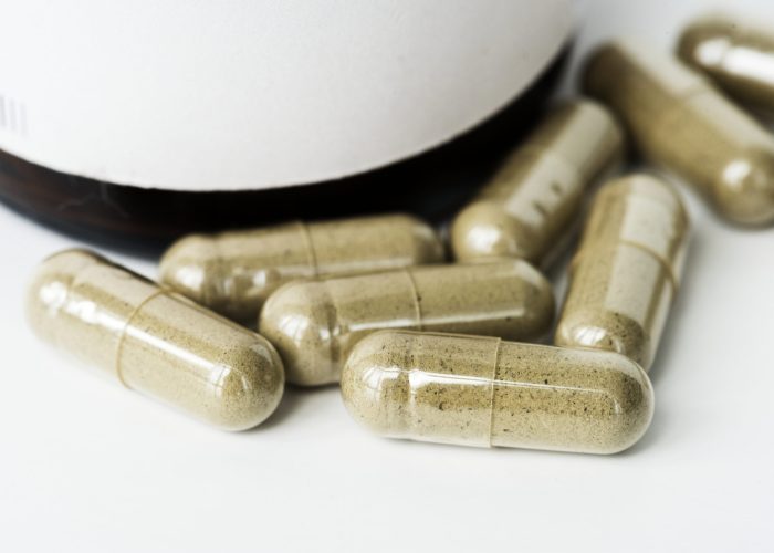 closeup capsule pills isolated white background